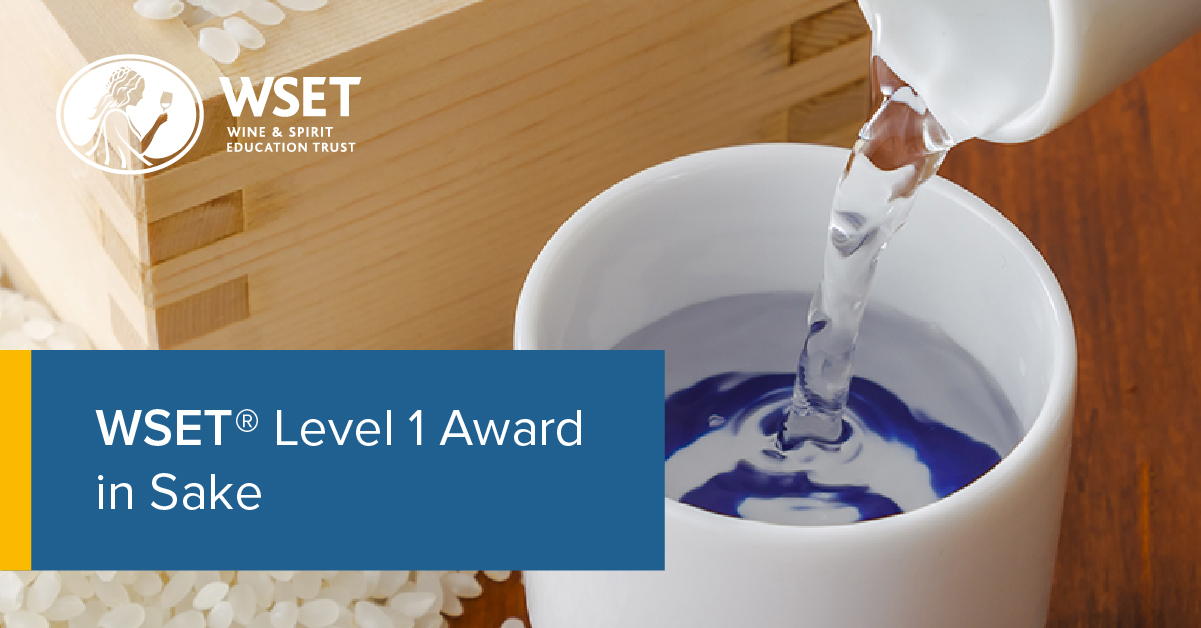 Image of sake poured in a traditional sake cup with blue rings with rice on the side. Logo that says WSET Wine & Spirit Education Trust and text that says WSET Level 1 Award in Sake.